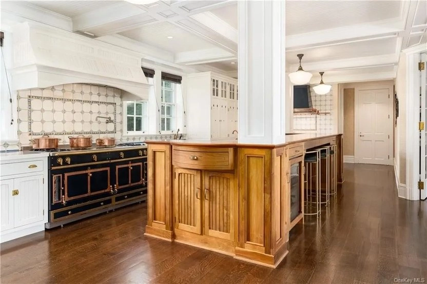 Kitchen with dual ranges and lovely island.