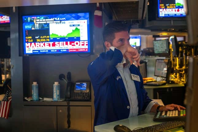 Traders work on the floor of the New York Stock Exchange on Aug. 5 in New York City.