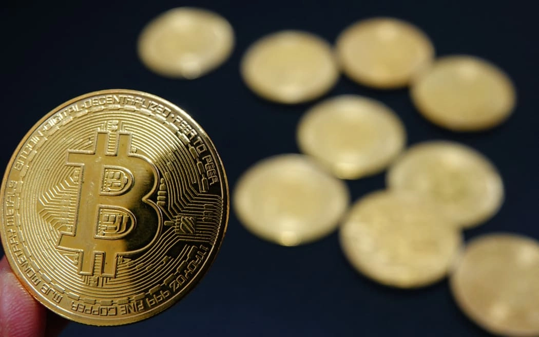 Commemorative bitcoin coins are in Yichang, Hubei province, China, on December 5, 2024. (Photo by Costfoto/NurPhoto) (Photo by CFOTO / NurPhoto / NurPhoto via AFP)