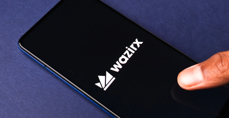 The WazirX logo on a phone