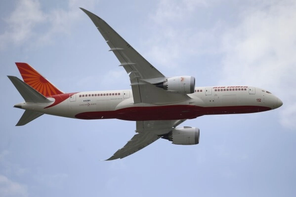 An Air India Boeing 787 Dreamliner performs its demonstration flight during the 50th Paris Air Show at Le Bourget airport, north of Paris, on June 18, 2013. (AP Photo/Francois Mori, File)