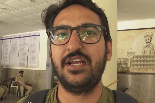 In this image taken from a video, Navin Chaudhary, a doctor who witnessed Thursday's Air India plane crash, speaks to The Associated Press in Ahmedabad, India, Monday, June 16, 2025. (AP Photo/Shonal Ganguly)