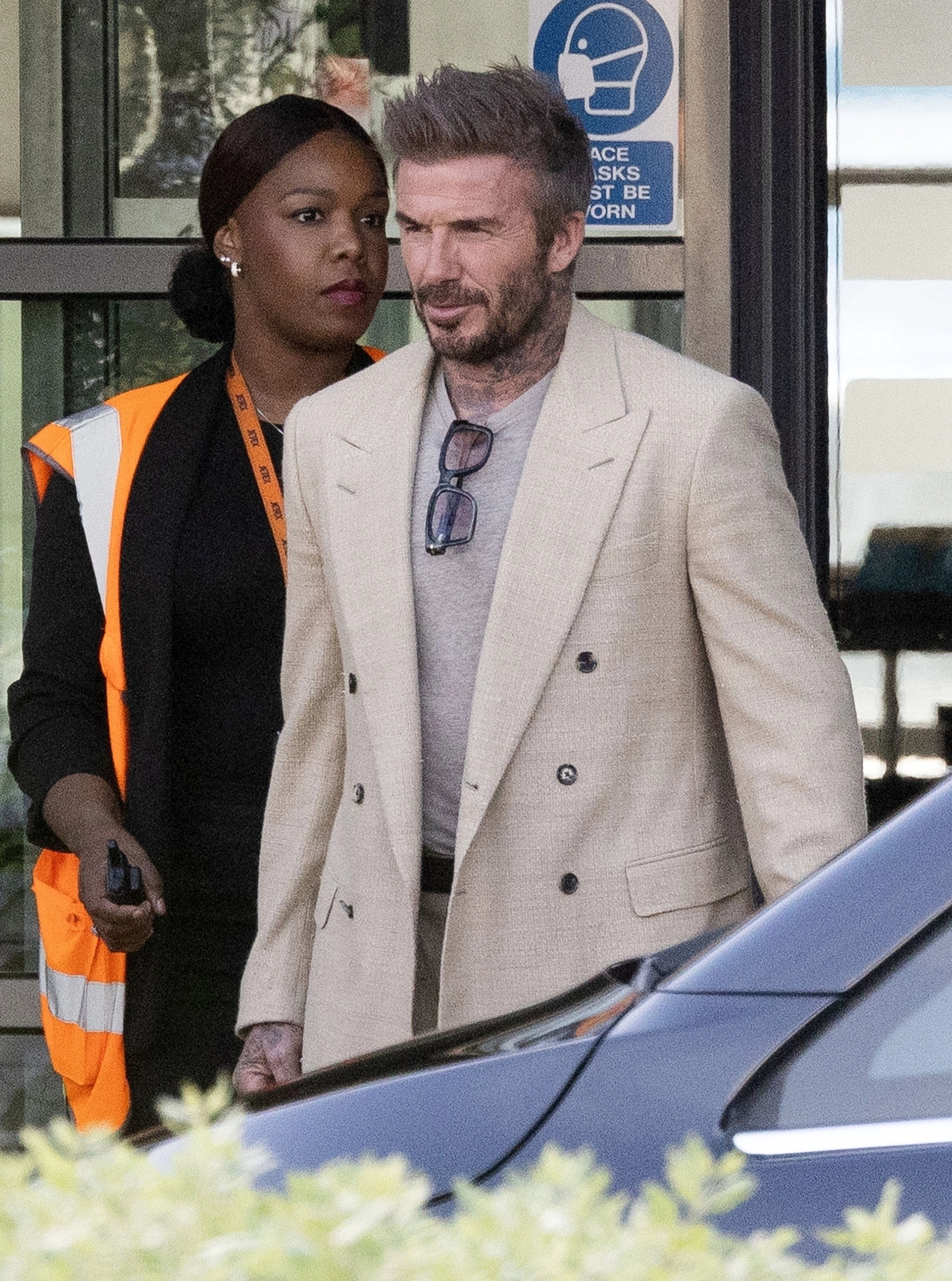 David Beckham arriving at an airport.