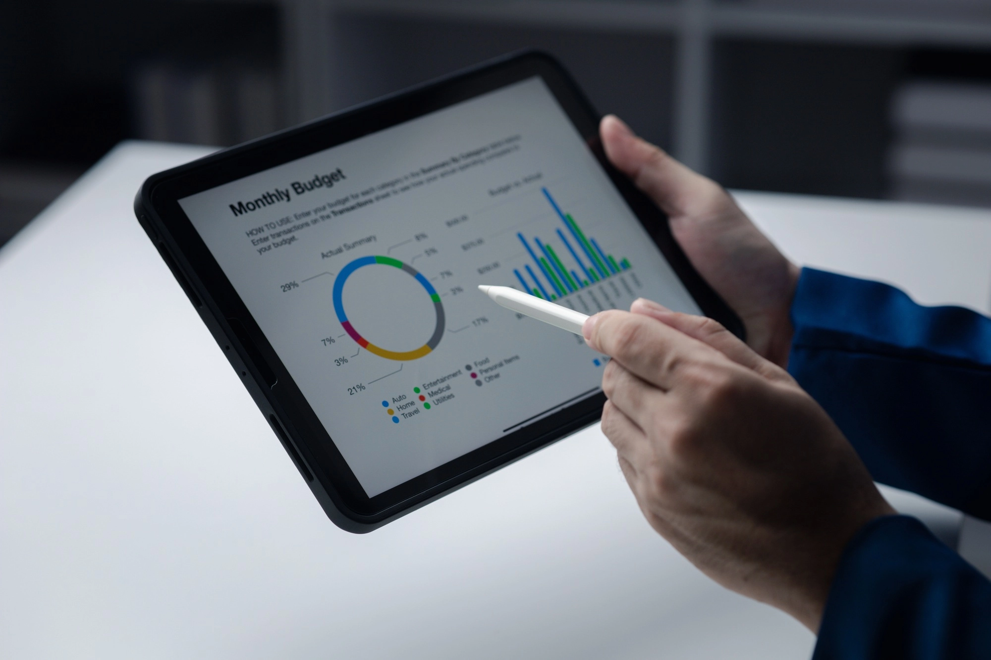 Person looking at data on tablet, businessman owner of startup company checking financial documents