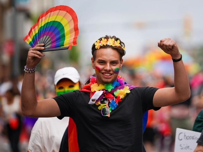 A person gestures during the Queen City Pride Parade
