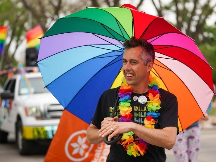 Sask NDP MLA Jared Clarke looks on during the Queen City Pride Parade