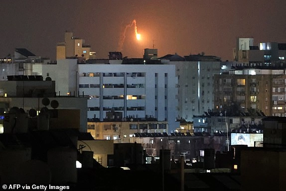 Rocket trails are seen in the sky above the Israeli coastal city of Netanya amid a fresh barrage of Iranian missile attacks on June 17, 2025. Israel and Iran exchanged fire again on June 17, the fifth day of strikes in their most intense confrontation in history, fuelling fears of a drawn-out conflict that could engulf the Middle East. (Photo by JACK GUEZ / AFP) (Photo by JACK GUEZ/AFP via Getty Images)