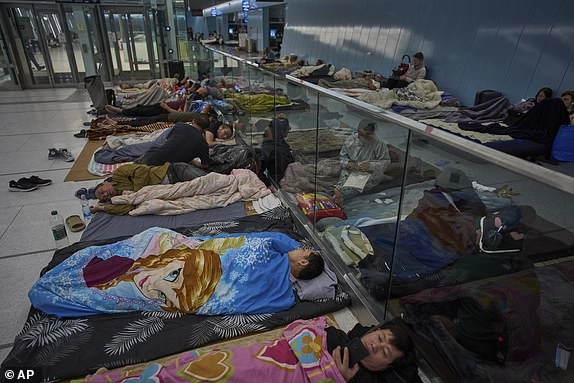 People take shelter in an underground metro station as a precaution against possible Iran missile attacks, in Ramat Gan, near Tel Aviv, Israel, Tuesday, June 17, 2025. (AP Photo/Oded Balilty)