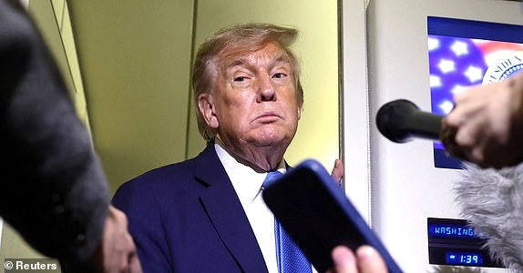 U.S. President Donald Trump speaks to reporters aboard Air Force One after departing early from the the G7 summit in Canada to return to Washington, June 17, 2025. REUTERS/Kevin Lamarque
