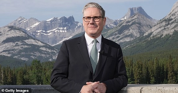KANANASKIS, CANADA - JUNE 16: UK Prime Minister Sir Keir Starmer conducting media interviews during the G7 summit on June 17, 2025 in Kananaskis, Alberta. Canada is hosting this year's meeting of the world's seven largest economies. (Photo by Stefan Rousseau - Pool/Getty Images)