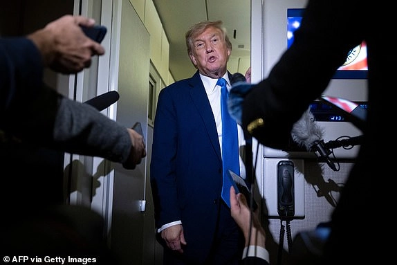 TOPSHOT - US President Donald Trump speaks to reporters about the G7 Summit aboard Air Force One while travelling back to Washington from Canada on June 16, 2025. US President Donald Trump left a G7 summit in Canada a day early on June 16, heading back to the White House as Israel and Iran traded missile fire for a fifth straight day. (Photo by Brendan Smialowski / AFP) (Photo by BRENDAN SMIALOWSKI/AFP via Getty Images)