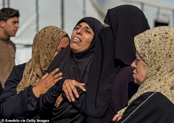 KHAN YUNIS, GAZA - JUNE 16: Relatives of Palestinians who lost their lives after Israeli army strikes targeted several locations, including tents for displaced people in the al-Mawasi area, mourn for them after they are being brought to the Nasser Hospital for their funeral process in Khan Yunis, Gaza on June 16, 2025. (Photo by Abdallah F.s. Alattar/Anadolu via Getty Images)