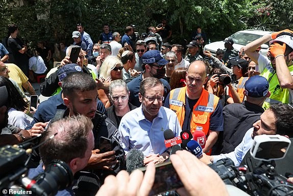 Israel's President Isaac Herzog speaks to the press following a missile attack from Iran, in Bat Yam, Israel, June 15, 2025. REUTERS/Ronen Zvulun