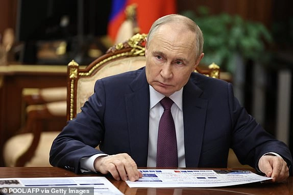 In this pool photograph distributed by the Russian state agency Sputnik, Russia's President Vladimir Putin meets with the Governor of Sevastopol in Moscow on June 16, 2025. (Photo by Gavriil Grigorov / POOL / AFP) (Photo by GAVRIIL GRIGOROV/POOL/AFP via Getty Images)