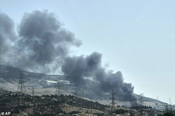 Smoke rises from an oil storage facility after it appeared to have been struck by an Israeli strike on Saturday, in Tehran, Iran, Monday, June 16, 2025. (AP Photo/Vahid Salemi)