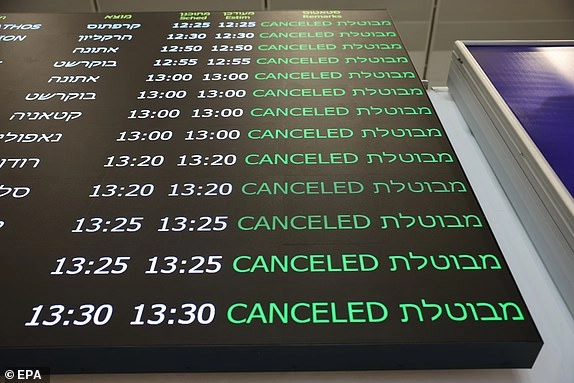 epa12178582 A flight status display shows cancelled flights in the departure terminal at Ben Gurion Airport near Tel Aviv, Israel, 16 June 2025. The Israel Airports Authority (IAA) suspended all travel at the airport after Israel launched strikes on Iran on 13 June, leaving tens of thousands of Israelis stranded abroad. EPA/ABIR SULTAN