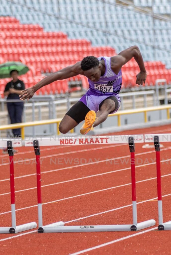 Roxborough Secondary School's Darius Moore competes in the boys' 17+ 400m hurdles, on the final day of the Secondary Schools Track and Field Champs, on June 17, at the Hasely Crawford Stadium, Port of Spain. - Photo by Jeff K. Mayers