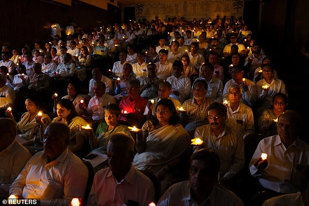 People hold candles as they take part in a special prayer ceremony for the victims of an Air India Boeing 787-8 Dreamliner plane, which crashed during take-off from an airport, in Ahmedabad, India, June 17, 2025