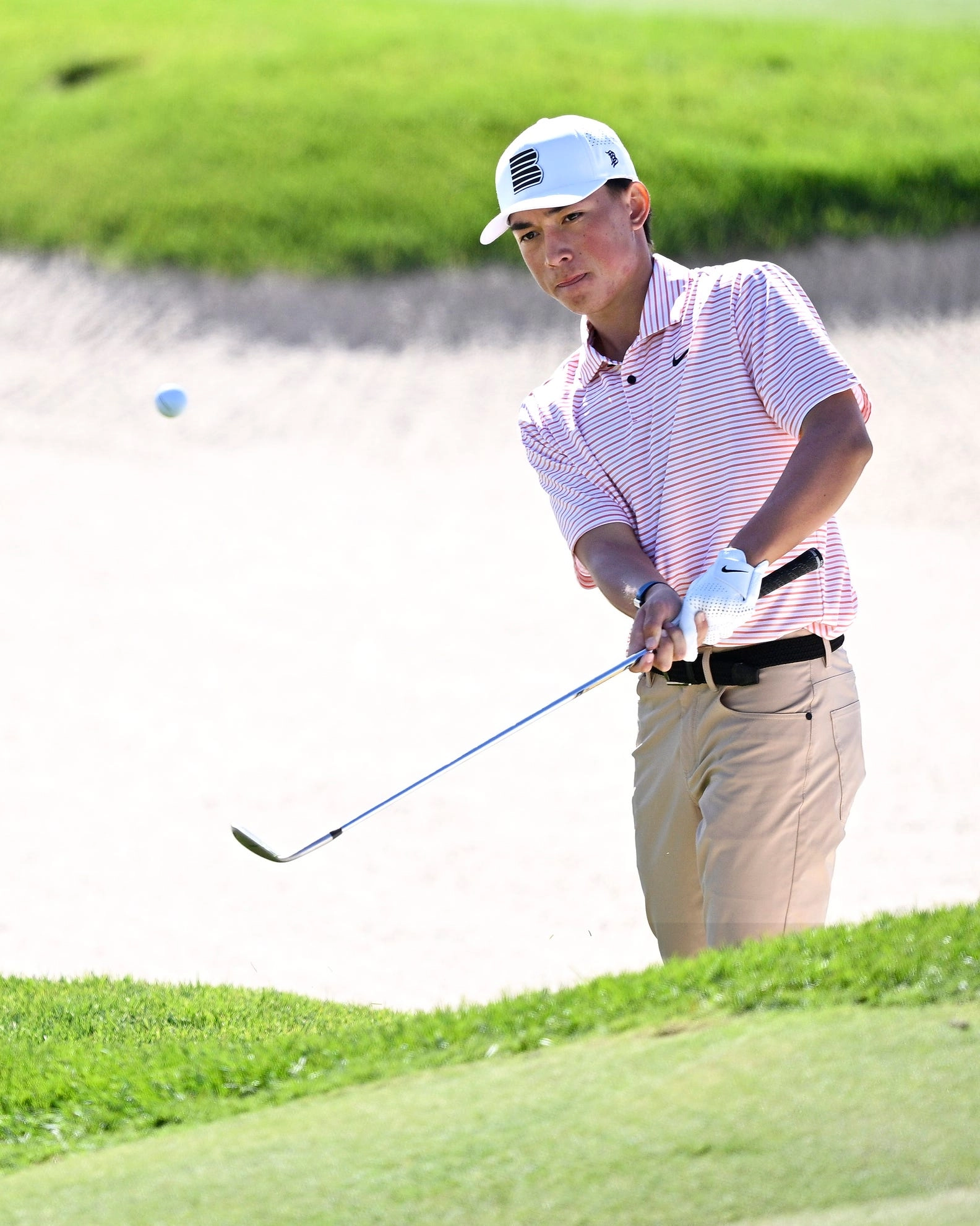st george, utah october 11: kihei akina of the united states plays a shot from a bunker on the 16th hole during the second round of the black desert championship 2024 at black desert resort on october 11, 2024 in st george, utah. (photo by orlando ramirez/getty images)