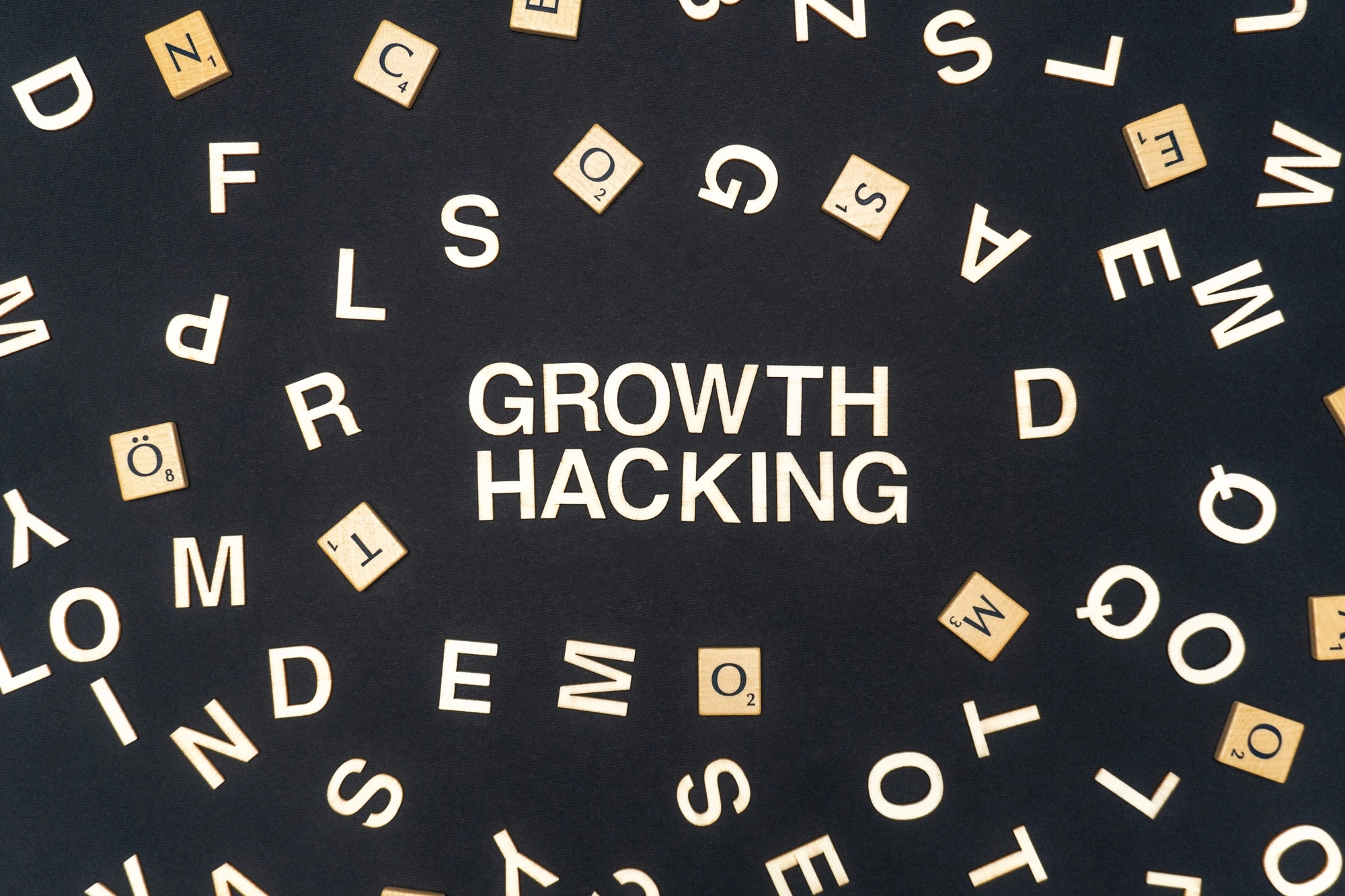 GROWTH HACKING word written on dark paper background. GROWTH HACKING text for your concepts