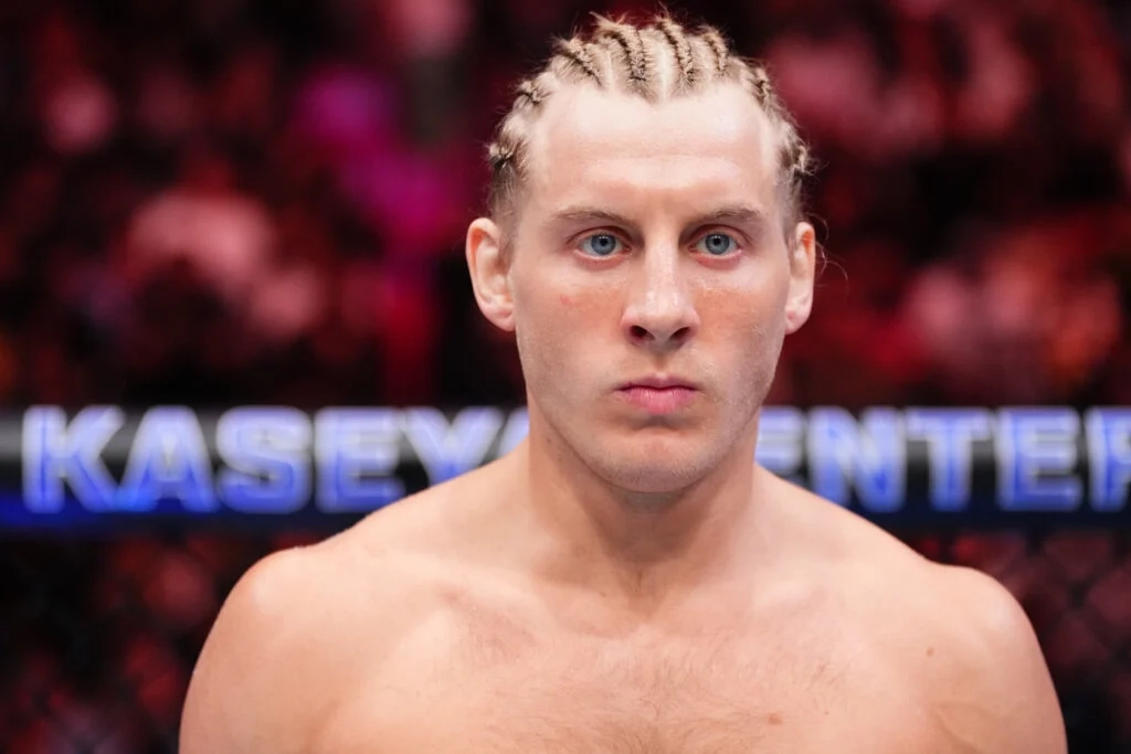 Paddy Pimblett stares down his opponent in the cage at UFC 314