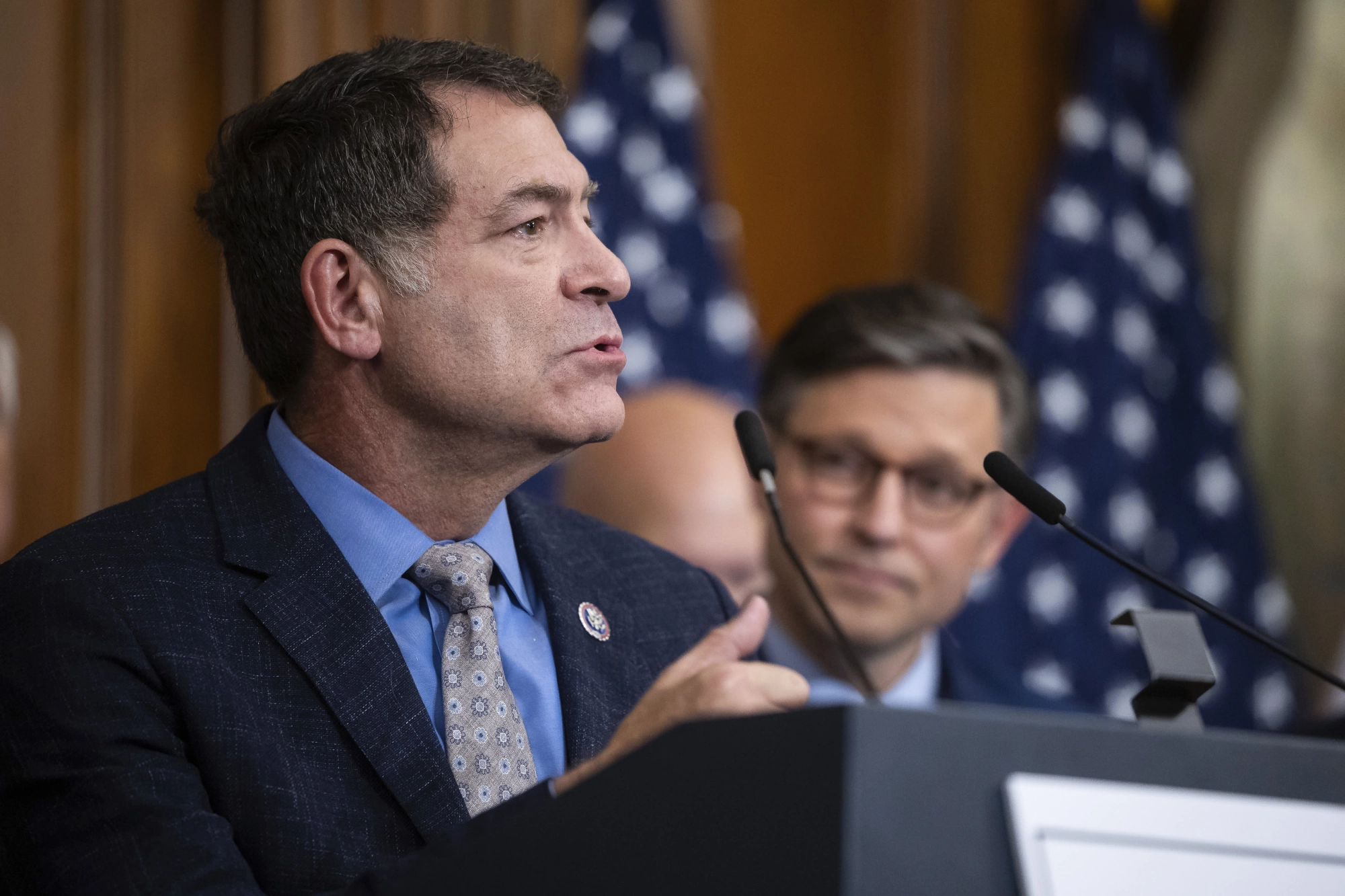 House Homeland Security Committee Chair Mark Green (R-Tenn.) speaks alongside House Speaker Mike Johnson (R-La.) after the House passed budget reconciliation legislation at the U.S. Capitol on May 22, 2025.