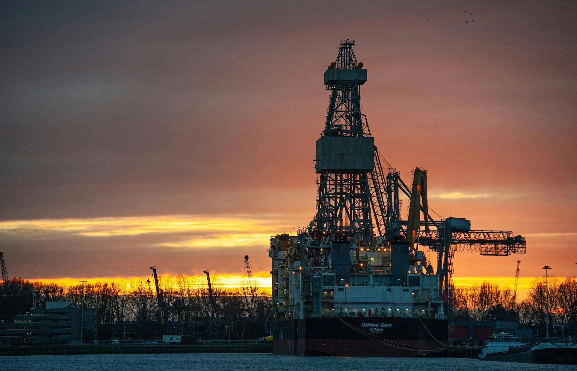 The sun sets on the mining vessel Hidden Gem in Rotterdam, South Holland, Netherlands, 2022.