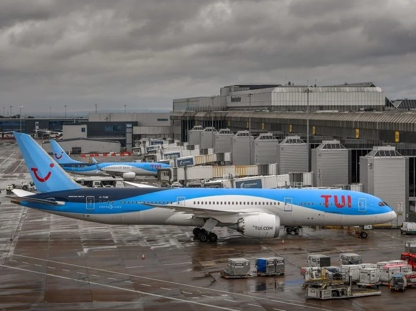 Aircraft operated by TUI are pictured at Manchester Airport in Manchester, north west England on July 27, 2020.