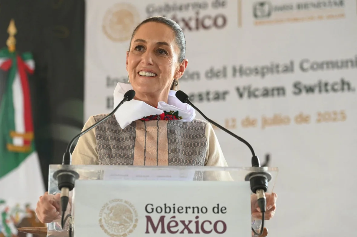 A person speaks at a lectern.