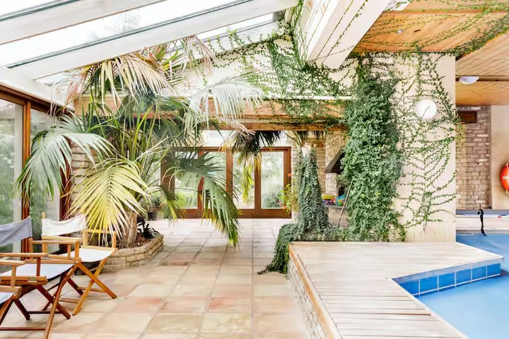 Converted granary with indoor pool and plants.
