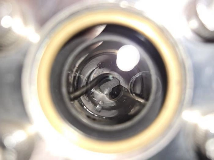 grey dust in the bottom of a clear glass cylinder