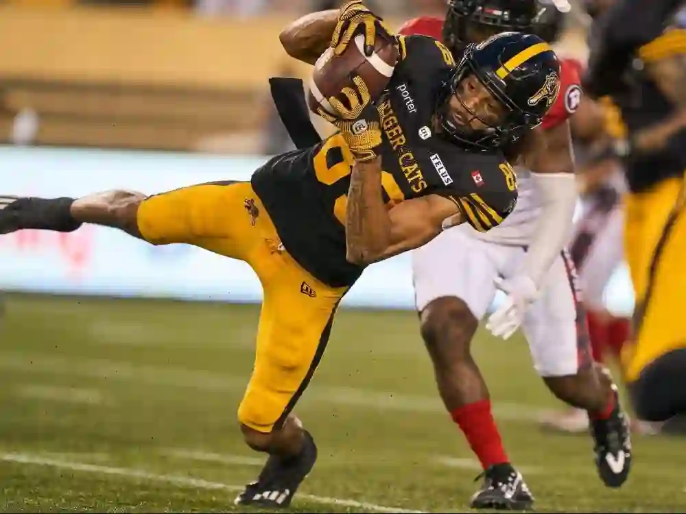 Kenny Lawler of the Hamilton Tiger-Cats catches a pass