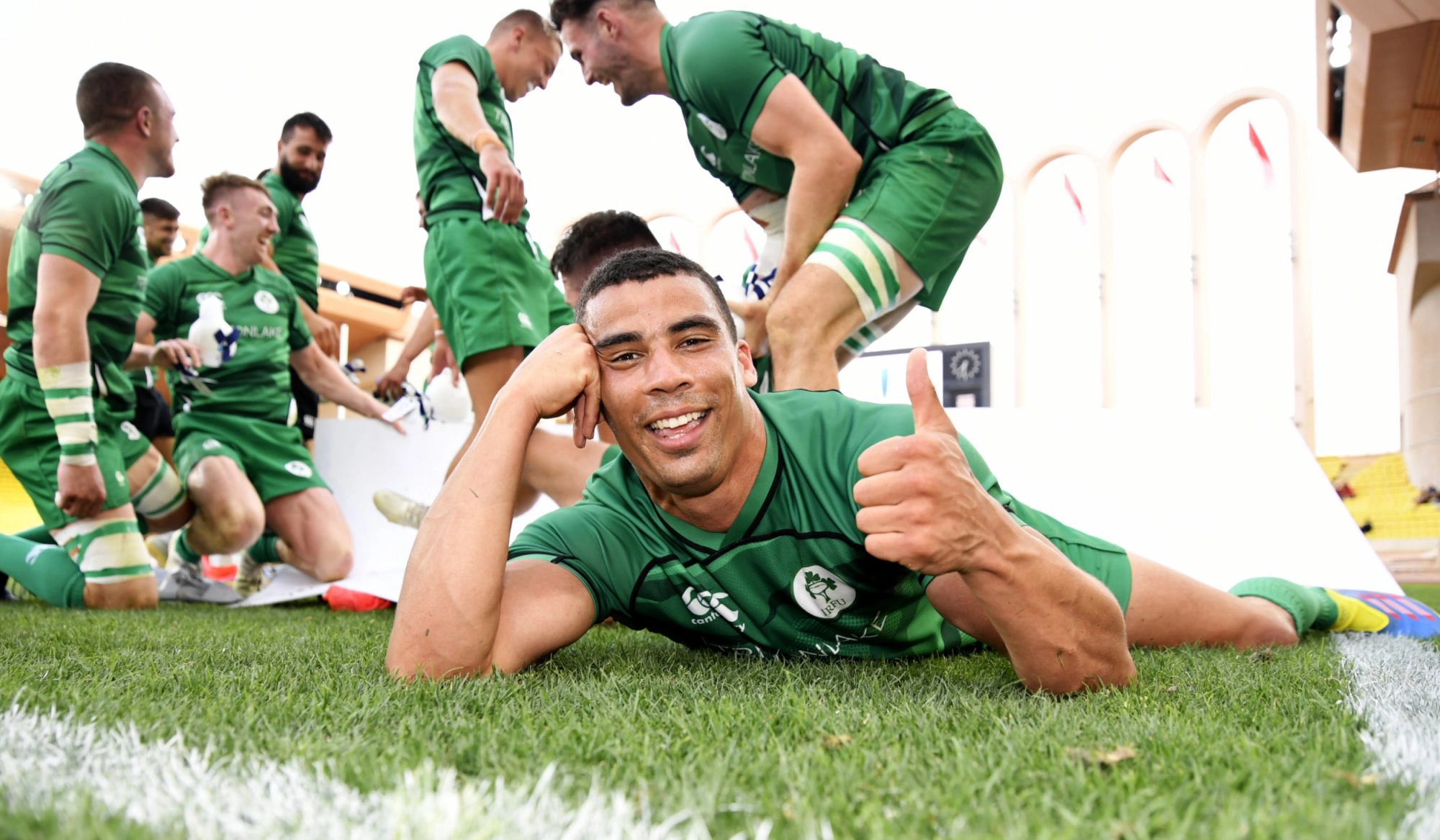 Irish rugby player giving thumbs up after a victory.
