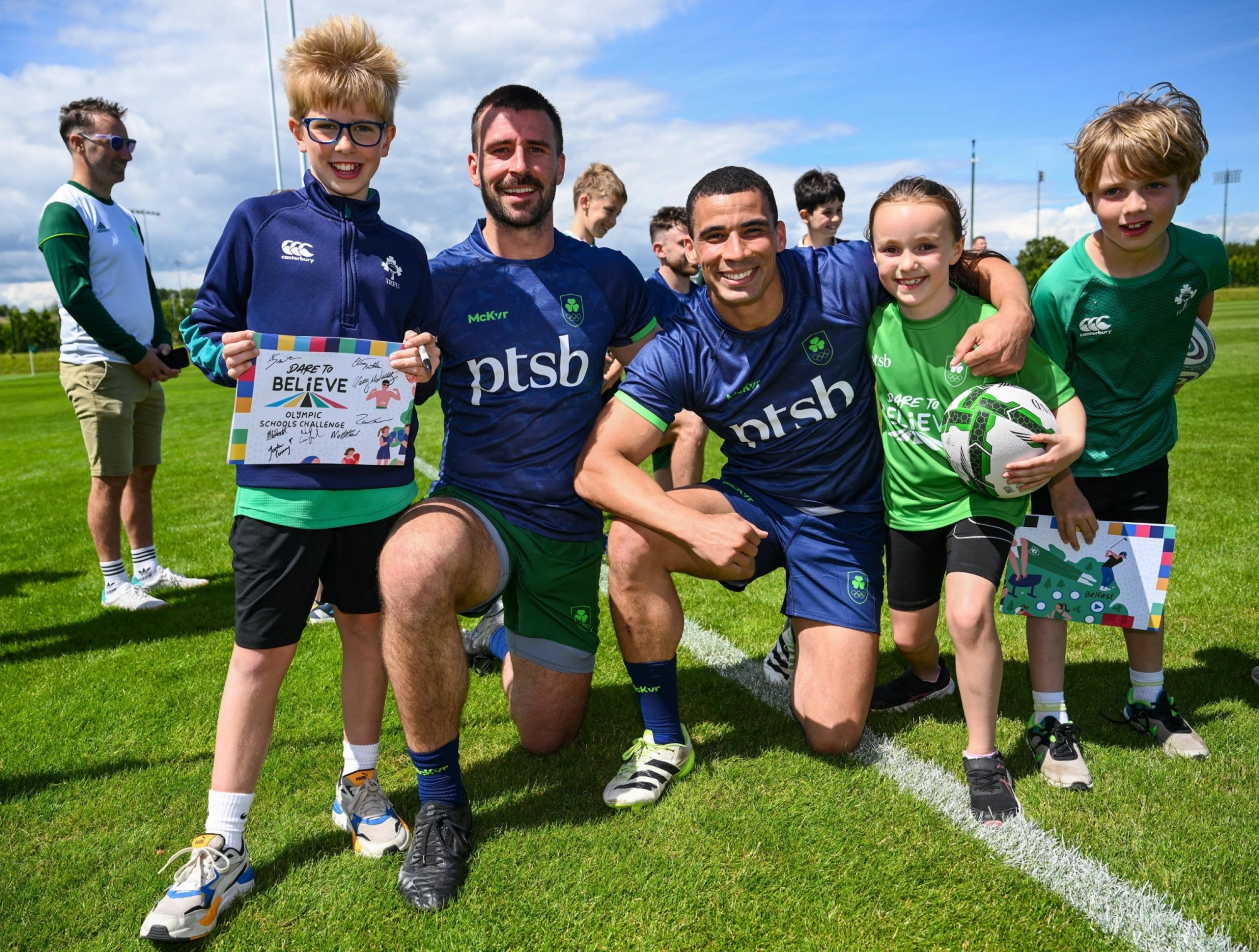Team Ireland rugby sevens players with young supporters.