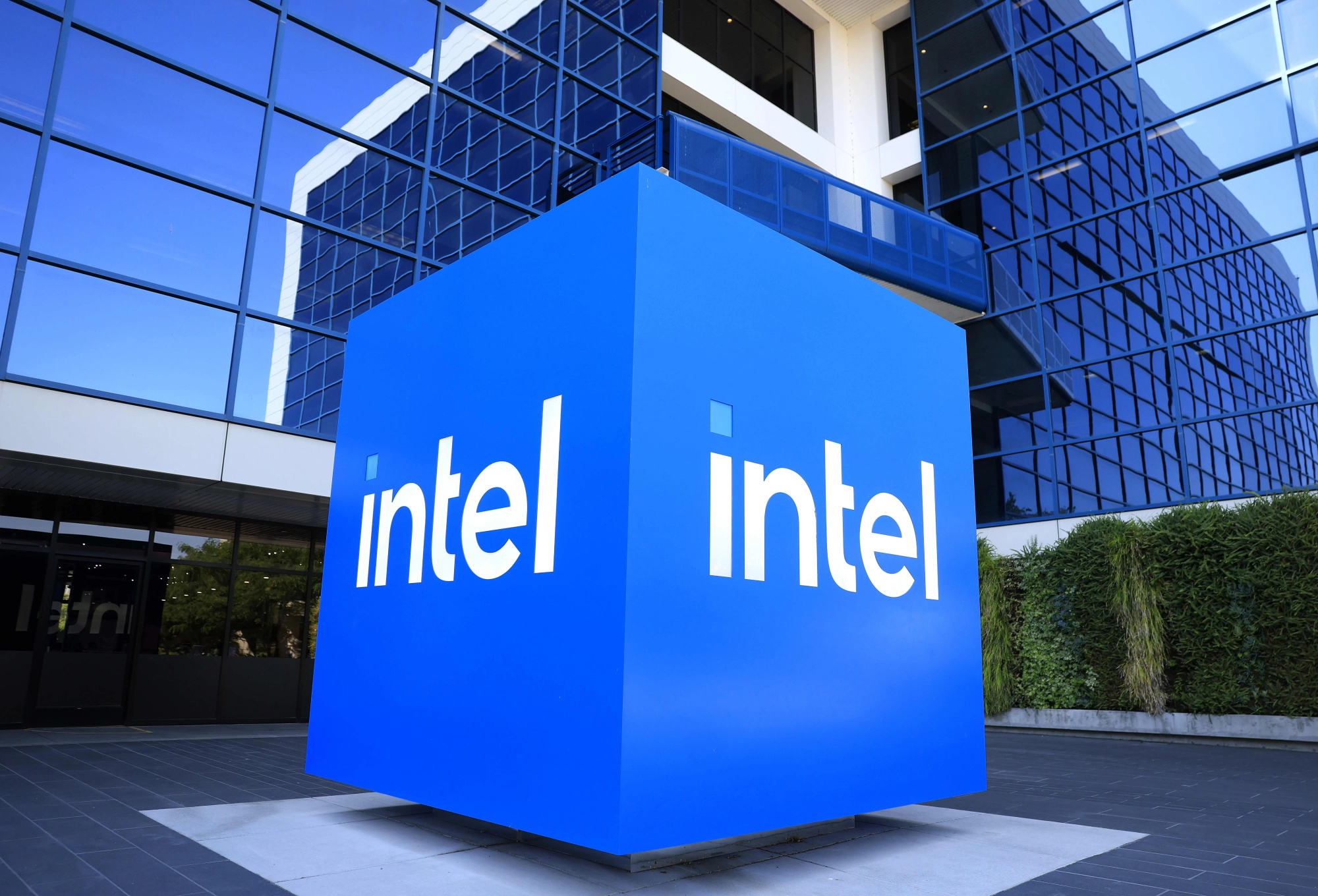 SANTA CLARA, CALIFORNIA - JULY 16: The Intel logo is displayed on a sign in front of Intel headquarters on July 16, 2025 in Santa Clara, California. Intel is laying off nearly 4,000 employees in offices across the United States in the coming weeks as part of a company-wide cost-cutting push led by new CEO Lip-Bu Tan. (Photo by Justin Sullivan/Getty Images)