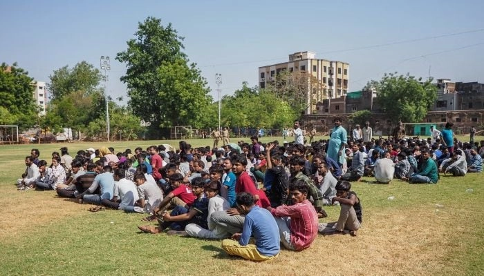 Suspected Bangladeshi migrants detained by police during an overnight operation in Ahmedabad, Gujarat, India, on 26 April 2025.  AFP