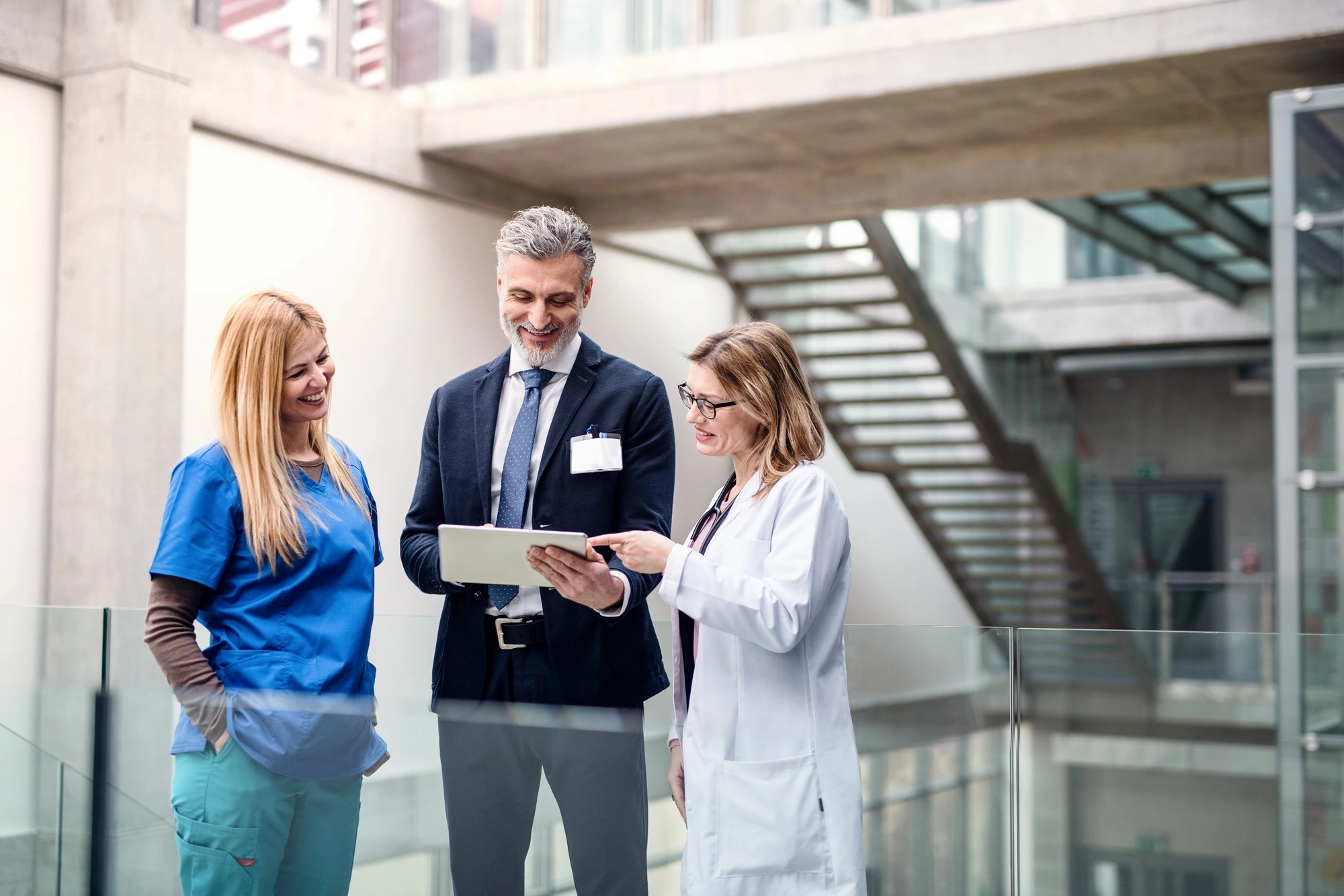 Group of doctors talking to pharmaceutical sales representative