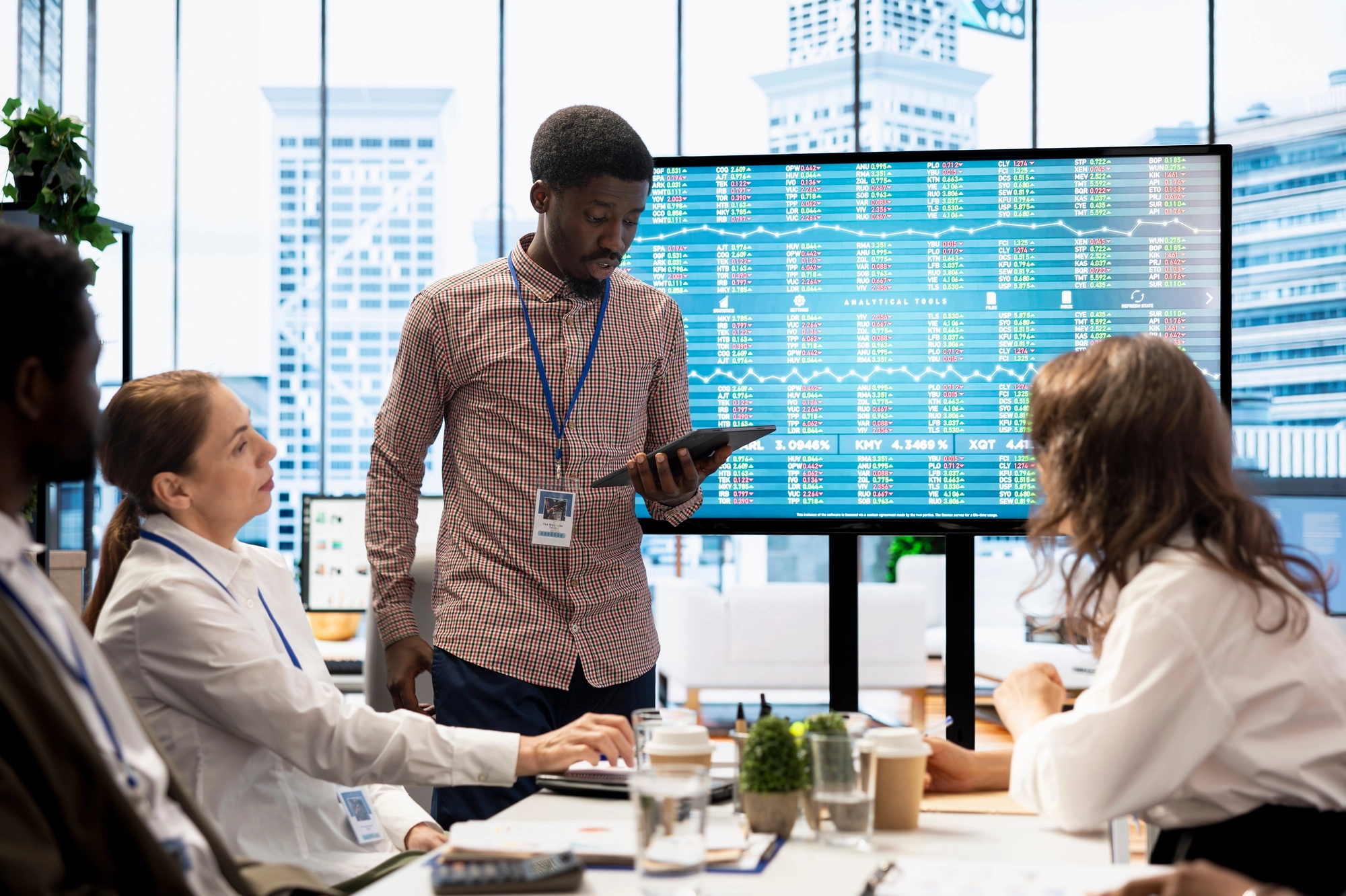 Team of company analysts reviews feedback on sales and orders