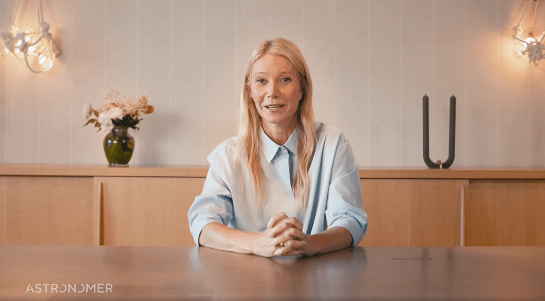 Gwyneth Paltrow sitting at a table.
