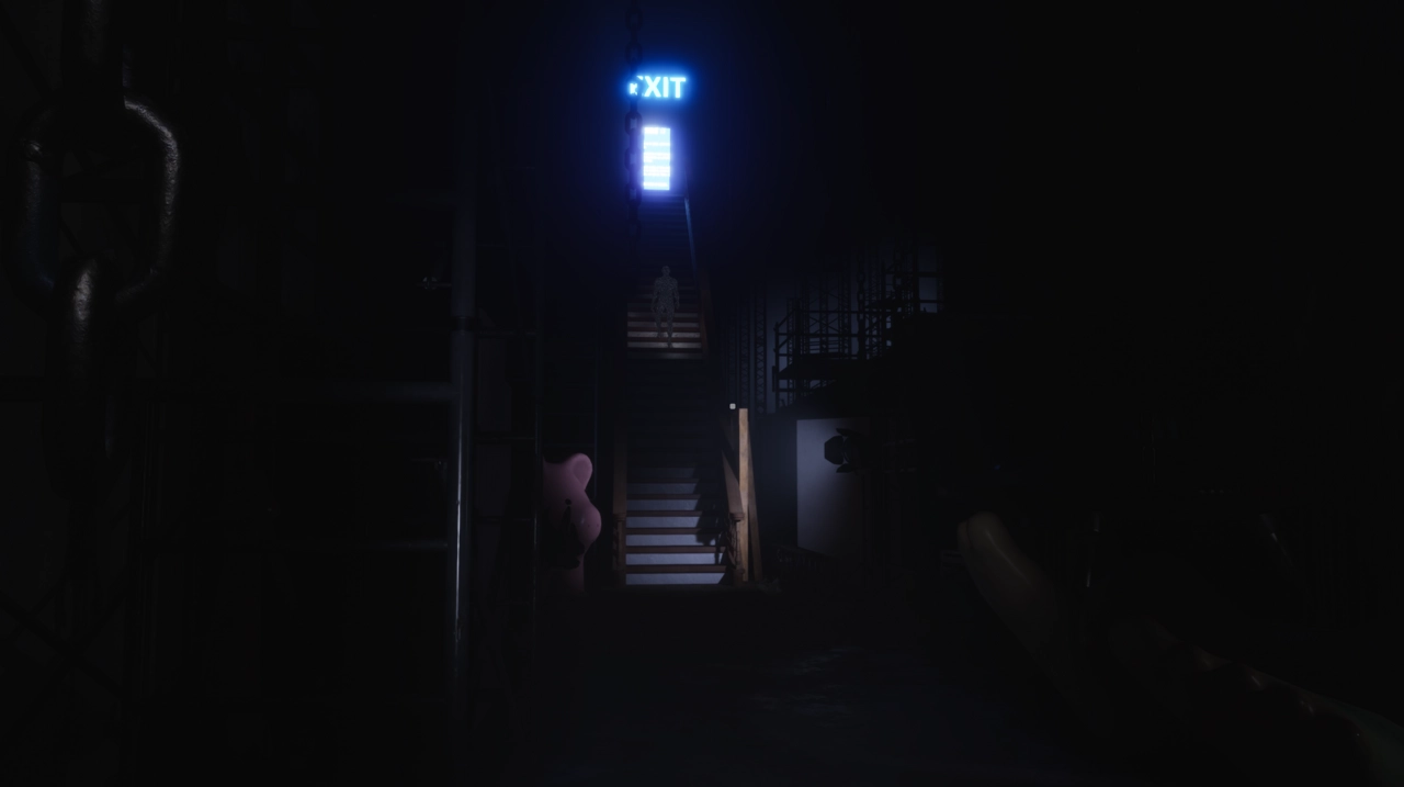 Head toward the figure on the stairs.