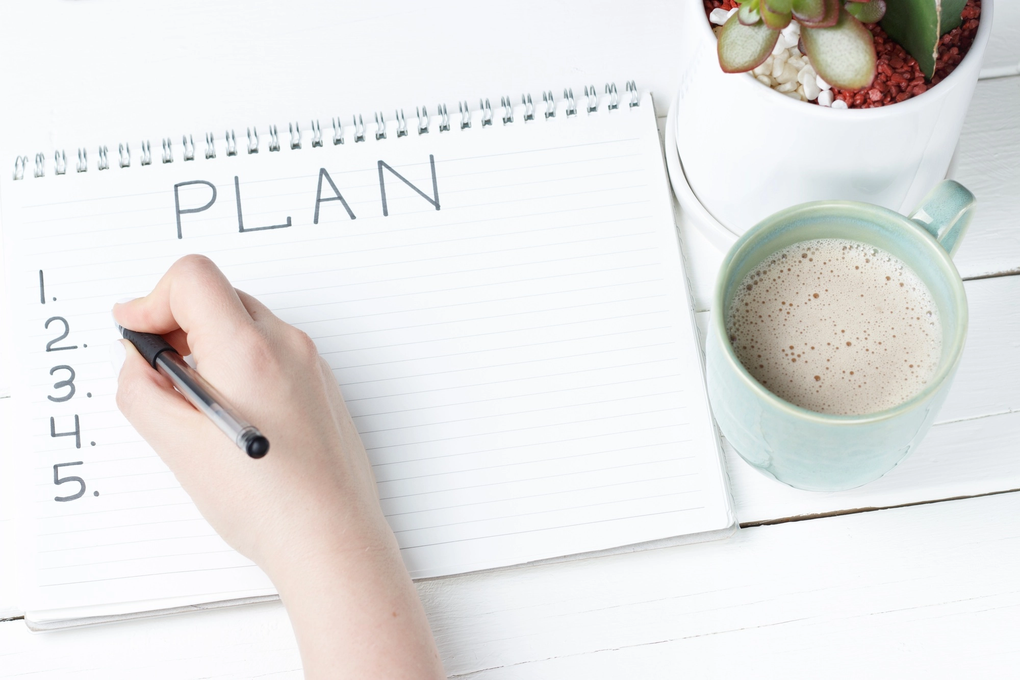 Inscription Plan in notepad, close-up, top view, concept of planning, goal setting