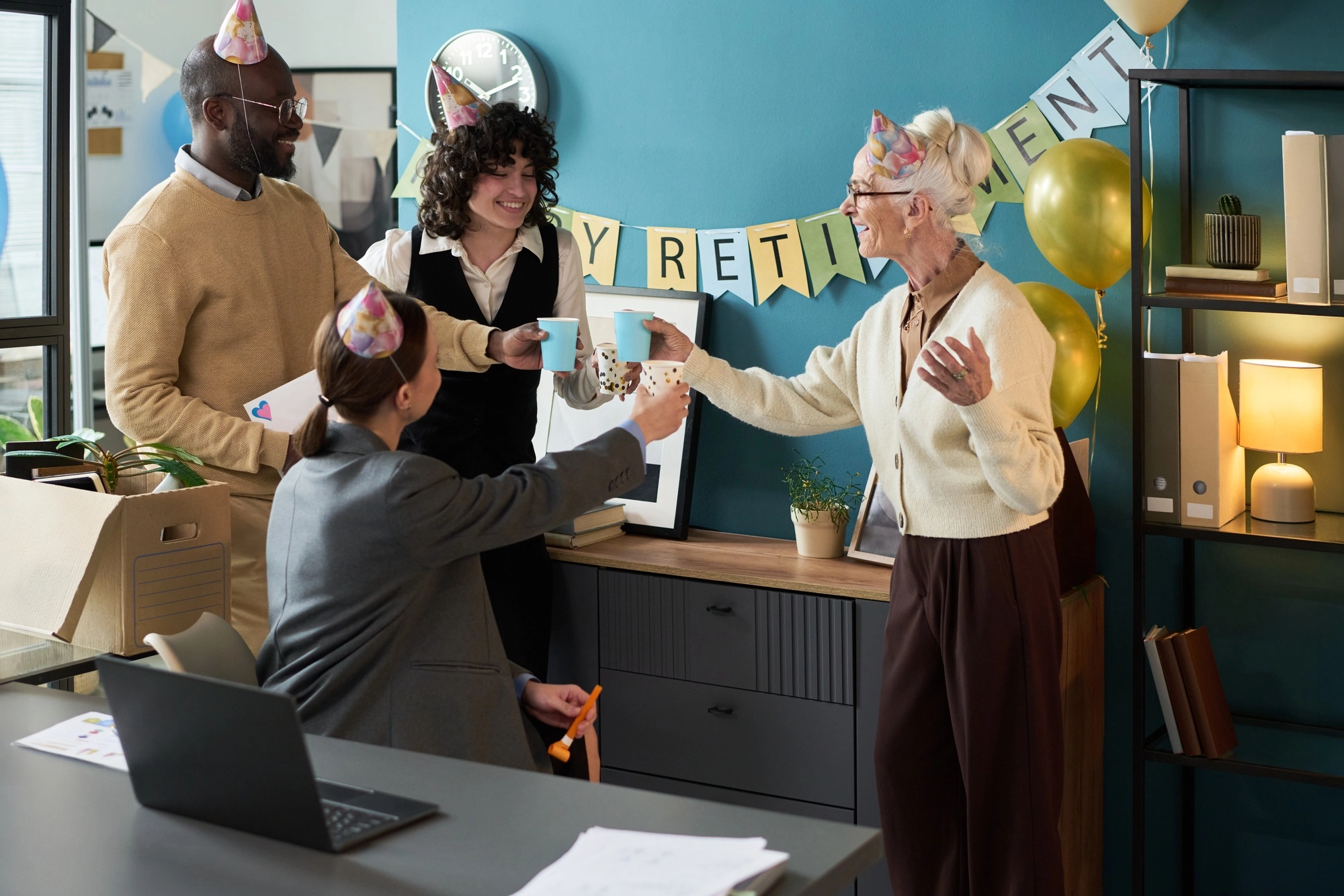 Senior Caucasian Woman Celebrating Retirement with Diverse Coworkers in Office