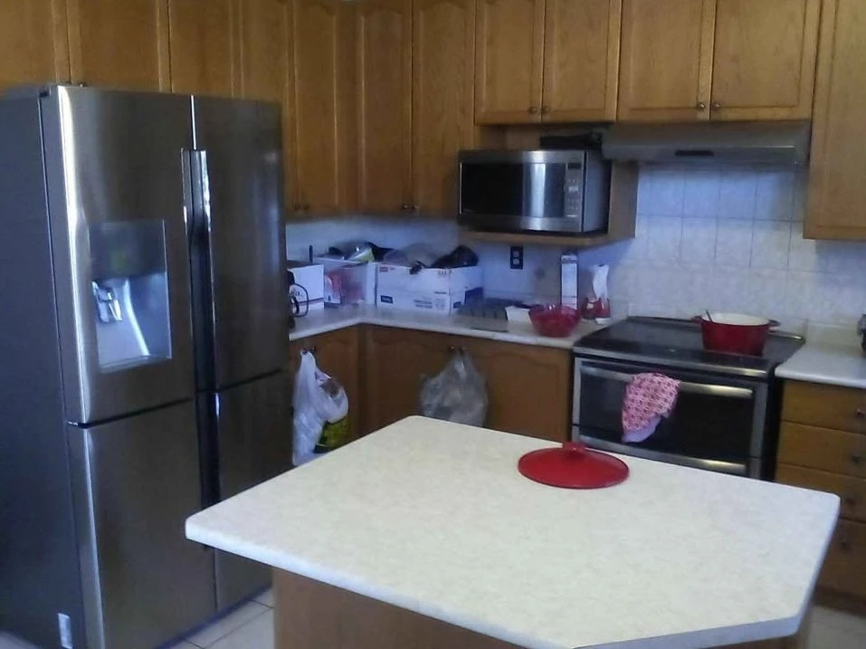 Kitchen in Brampton home as part of rental where the bed is on second-floor landing.