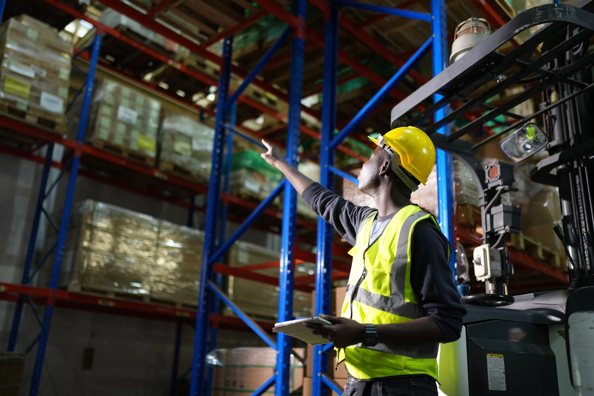 worker checking stock in the warehouse