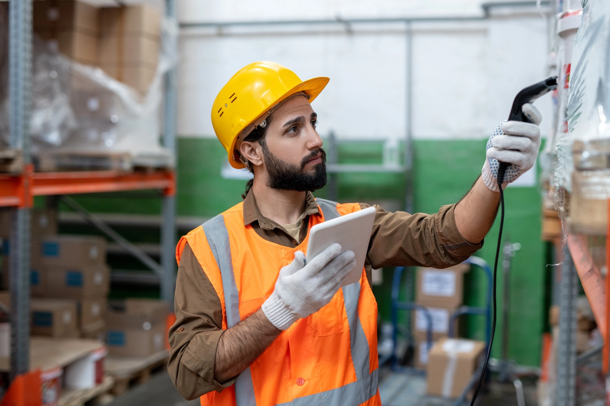 Bearded man doing stock inventory