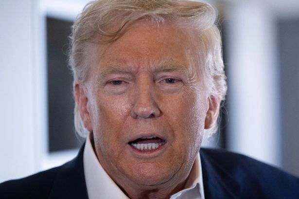 Donald Trump speaks to reporters
