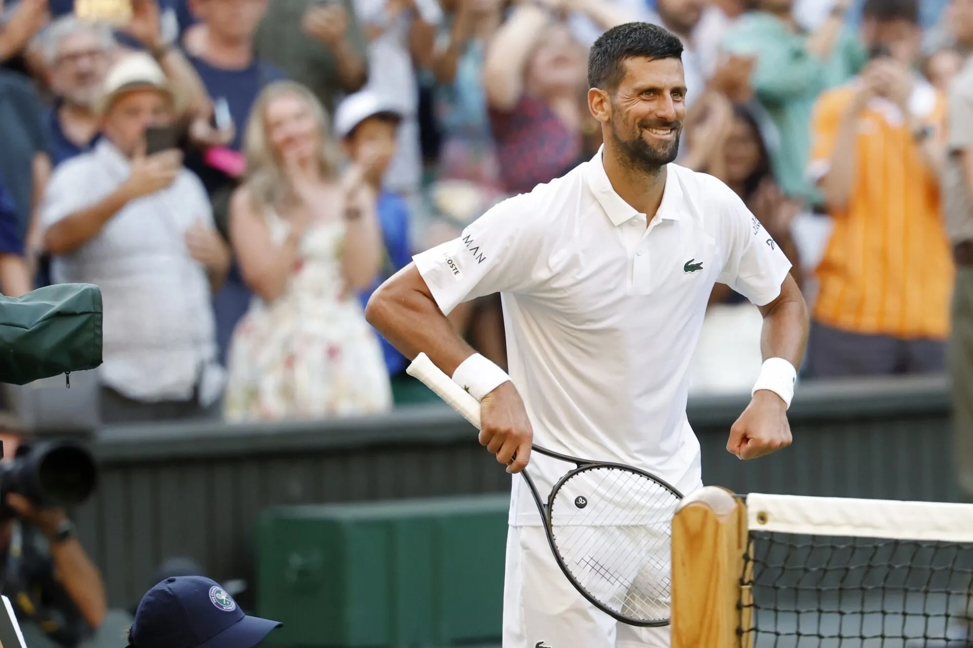 Novak Djokovic (SRB) dances on the court towards his daughter in the player's box after his match against Flavio Cobolli (ITA)(not pictured) in a gentlemen's singles quarter-final on day ten of these Championships Wimbledon 2025 at All England Lawn Tennis and Croquet Club.