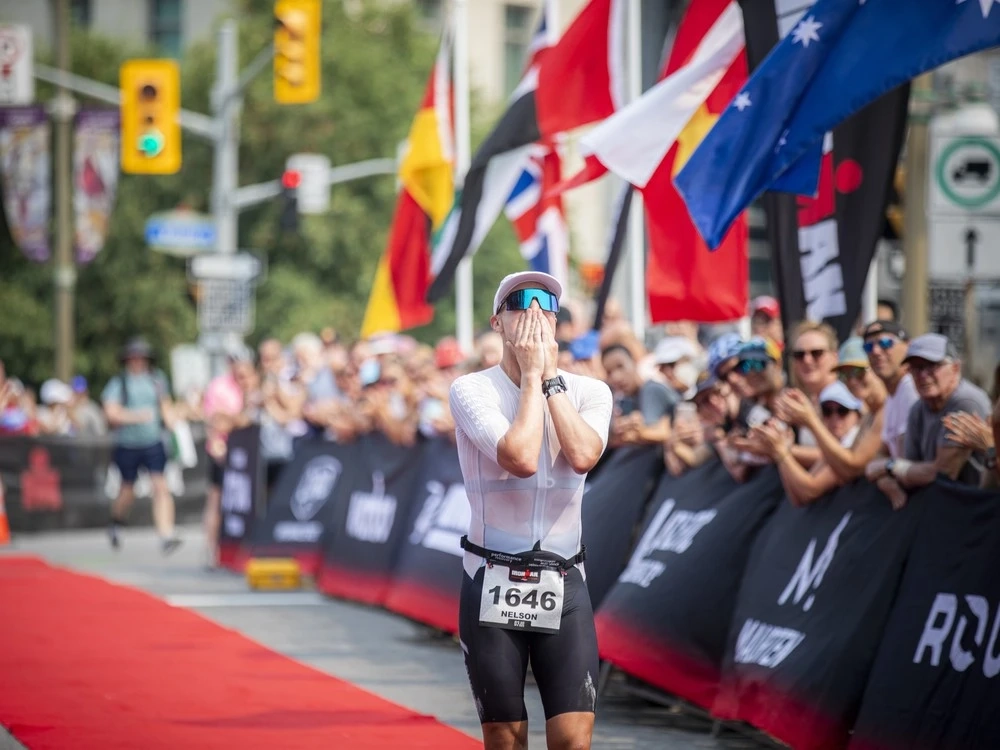 Nelson Alexander Doleman reacted to finishing his Ironman race, ranking fourth overall Sunday.