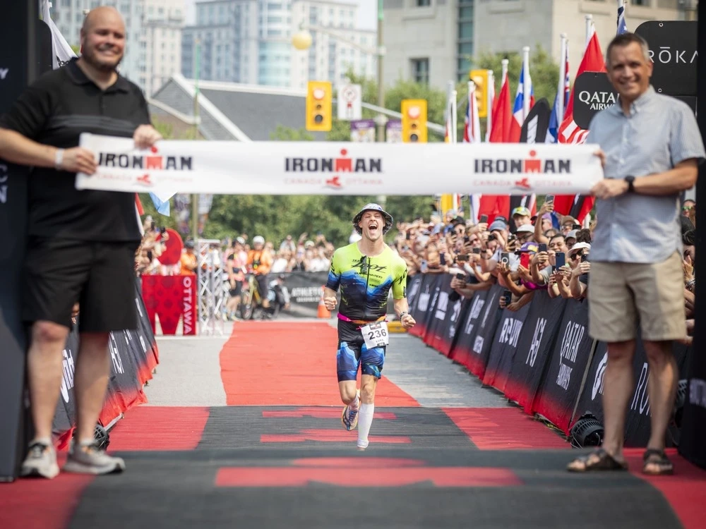 Luke Evans was the first person to cross the finish line Sunday afternoon, finishing the gruelling three-discipline race in 8:40:22. Evans, no stranger to Ottawa, is a Carleton University grad.