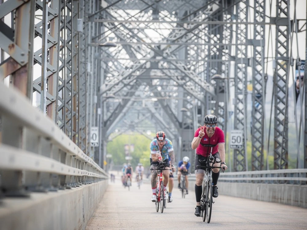 Samuel Thomas threw up a peace sign while crossing the Interprovincial bridge Sunday.